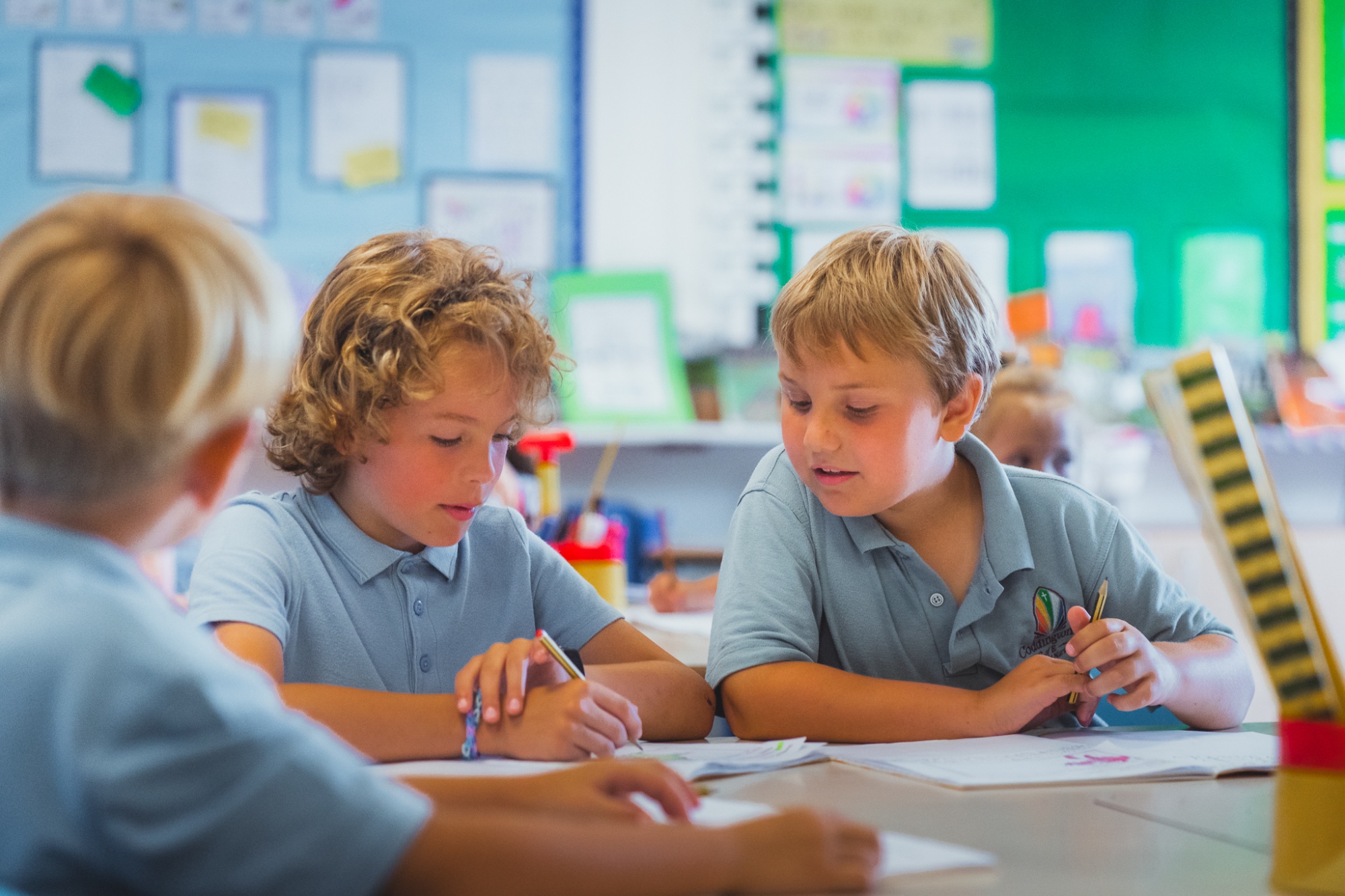 three students in lesson working together