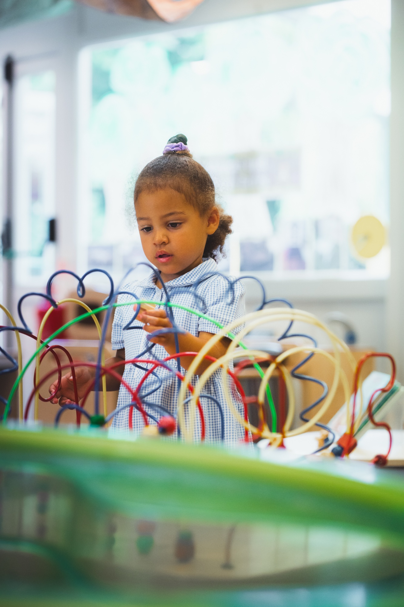 student in nursery playing